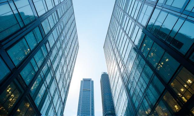 Modern London office buildings reflecting the sky